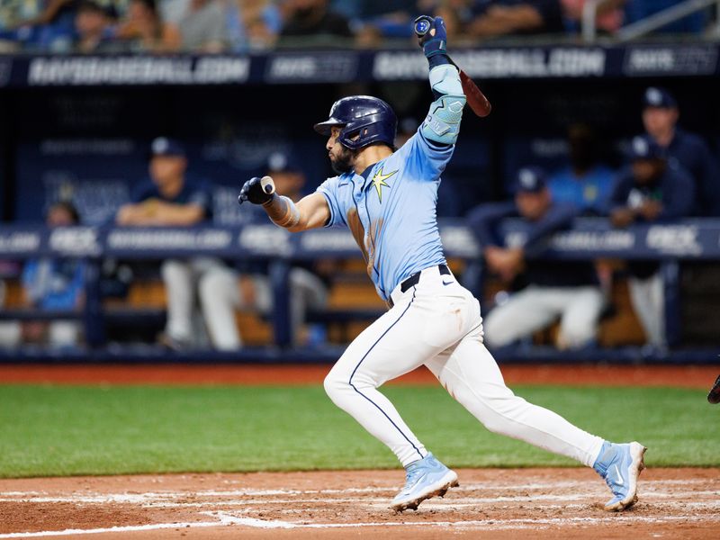 May 22, 2024; St. Petersburg, Florida, USA;  Tampa Bay Rays shortstop Jose Caballero (7) singles against the Boston Red Sox in the fourth inning at Tropicana Field. Mandatory Credit: Nathan Ray Seebeck-USA TODAY Sports