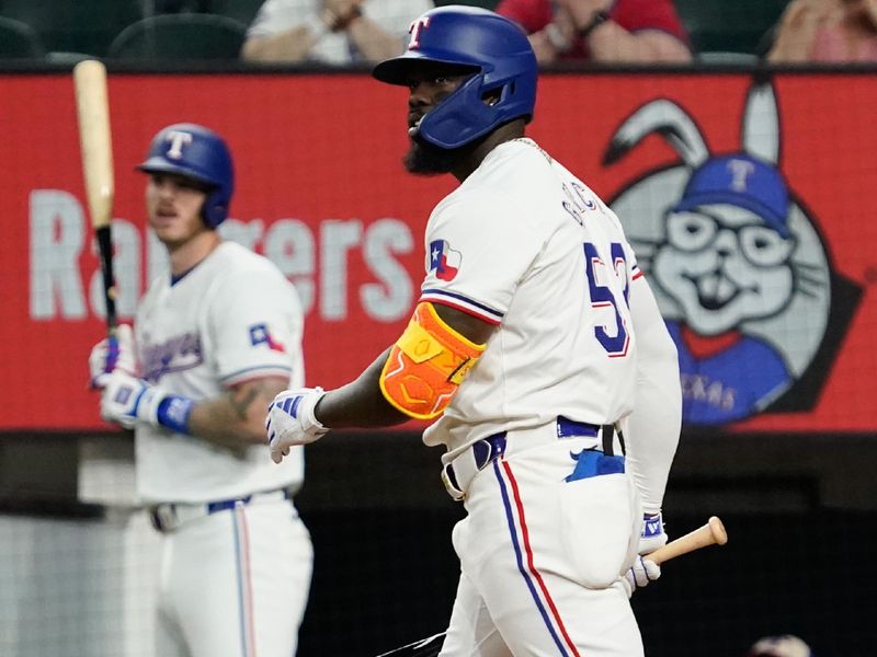 May 18, 2024; Arlington, Texas, USA; Texas Rangers right fielder Adolis Garcia (53) watches his solo home run during the sixth inning against the Los Angeles Angels at Globe Life Field. Mandatory Credit: Raymond Carlin III-USA TODAY Sports