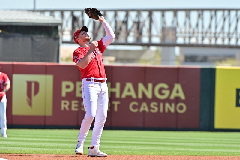 Feb 29, 2024; Tempe, Arizona, USA;  Los Angeles Angels second baseman Brandon Drury (23) catches a fly ball in the first inning against the Cleveland Guardians during a spring training game at Tempe Diablo Stadium. Mandatory Credit: Matt Kartozian-USA TODAY Sports