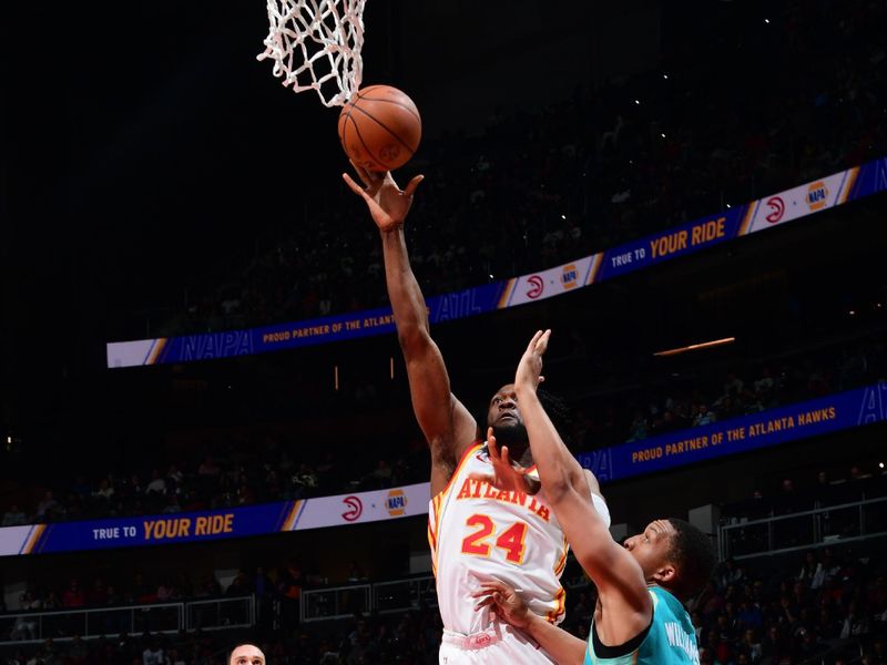 ATLANTA, GA - MARCH 23: Bruno Fernando #24 of the Atlanta Hawks shoots the ball during the game against the Charlotte Hornets on March 23, 2024 at State Farm Arena in Atlanta, Georgia.  NOTE TO USER: User expressly acknowledges and agrees that, by downloading and/or using this Photograph, user is consenting to the terms and conditions of the Getty Images License Agreement. Mandatory Copyright Notice: Copyright 2024 NBAE (Photo by Scott Cunningham/NBAE via Getty Images)