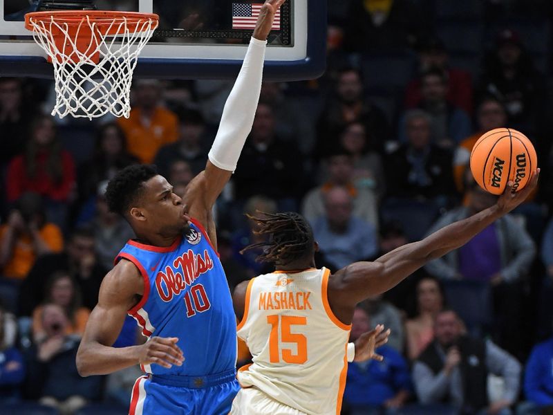 Mar 9, 2023; Nashville, TN, USA; Tennessee Volunteers guard Jahmai Mashack (15) attempts a shot around defense from Mississippi Rebels forward Theo Akwuba (10) during the second half at Bridgestone Arena. Mandatory Credit: Christopher Hanewinckel-USA TODAY Sports