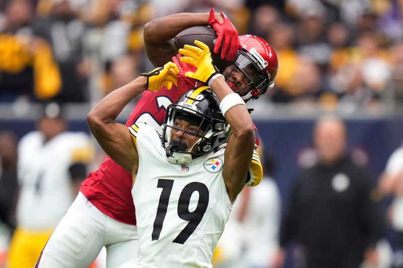 Houston Texans cornerback Steven Nelson, rear, intercepts a pass intended for Pittsburgh Steelers wide receiver Calvin Austin III (19) during the first half of an NFL football game Sunday, Oct. 1, 2023, in Houston. (AP Photo/Eric Christian Smith)