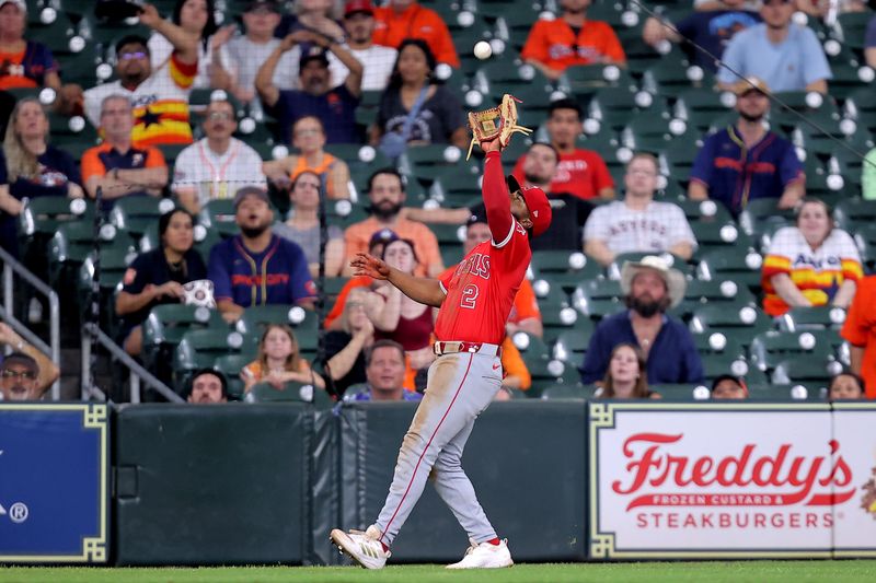 May 20, 2024; Houston, Texas, USA; Los Angeles Angels third baseman Luis Rengifo (2) catches a fly ball for an out against the Houston Astros during the eighth inning at Minute Maid Park. Mandatory Credit: Erik Williams-USA TODAY Sports