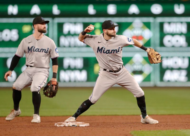 Sep 30, 2023; Pittsburgh, Pennsylvania, USA; Miami Marlins shortstop Garrett Hampson (1) throws to first base after a force-out at second base against the Pittsburgh Pirates during the second inning at PNC Park. Mandatory Credit: Charles LeClaire-USA TODAY Sports