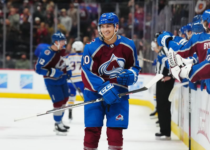 Dec 13, 2023; Denver, Colorado, USA; Colorado Avalanche defenseman Sam Malinski (70) reacts following his first career goal in the third period against the Buffalo Sabres at Ball Arena. Mandatory Credit: Ron Chenoy-USA TODAY Sports