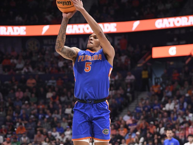 Mar 17, 2024; Nashville, TN, USA; Florida Gators guard Will Richard (5) shoots against the Auburn Tigers in the first half in the SEC Tournament championship game at Bridgestone Arena. Mandatory Credit: Steve Roberts-USA TODAY Sports