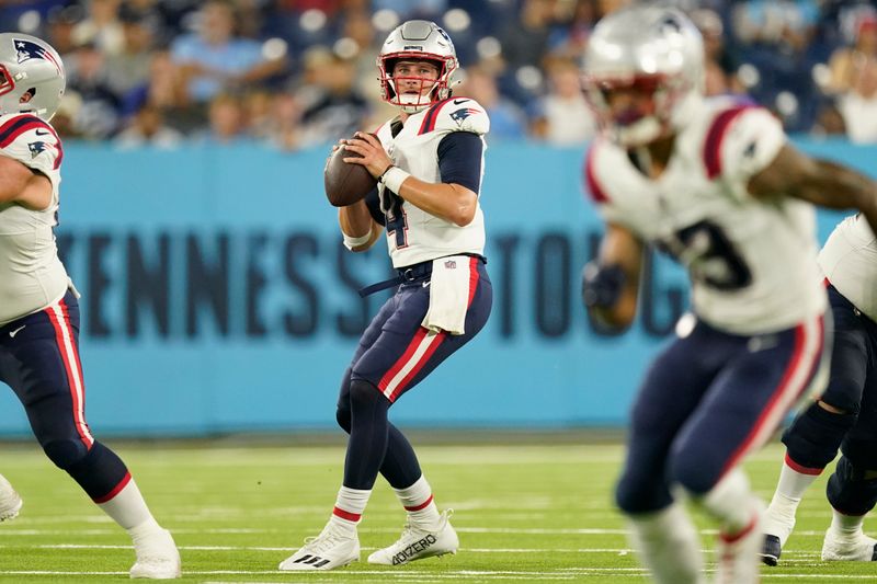 New England Patriots quarterback Bailey Zappe (4) plays against the Tennessee Titans in the first half of an NFL preseason football game Saturday, Aug. 26, 2023, in Nashville, Tenn. (AP Photo/George Walker IV)