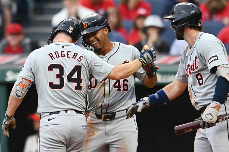 Jul 22, 2024; Cleveland, Ohio, USA; Detroit Tigers catcher Jake Rogers (34) celebrates with right fielder Wenceel Perez (46) and third baseman Matt Vierling (8) after scoring on a triple and a throwing error by Cleveland Guardians center fielder Angel Martinez (not pictured) during the second inning at Progressive Field. Mandatory Credit: Ken Blaze-USA TODAY Sports