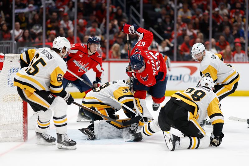 Apr 4, 2024; Washington, District of Columbia, USA; Pittsburgh Penguins goaltender Alex Nedeljkovic (39) makes a save on Washington Capitals left wing Max Pacioretty (67) in the third period at Capital One Arena. Mandatory Credit: Geoff Burke-USA TODAY Sports