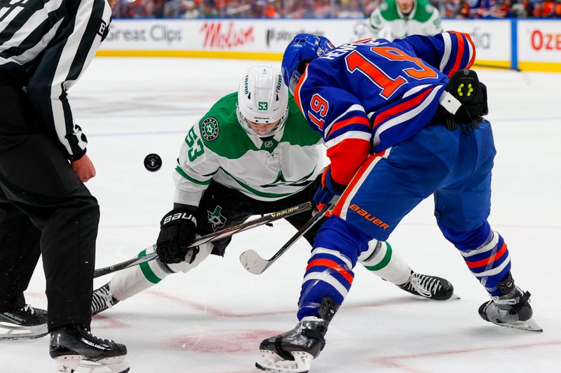 May 27, 2025; Edmonton, Alberta, CAN; Dallas Stars center Wyatt Johnston (53) and Edmonton Oilers center Adam Henrique (19) take the face-off during the second period in game four of the Western Conference Final of the 2025 Stanley Cup Playoffs at Rogers Place. Mandatory Credit: Perry Nelson-Imagn Images