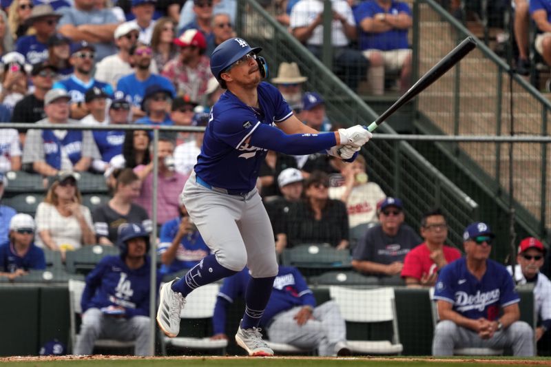 Mar 5, 2025; Tempe, Arizona, USA; Los Angeles Dodgers third base Enrique Hernandez (8) hits a double against the Los Angeles Angels in the second inning at Tempe Diablo Stadium. Mandatory Credit: Rick Scuteri-Imagn Images