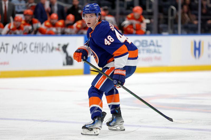 Dec 11, 2025; Elmont, New York, USA; New York Islanders defenseman Matthew Schaefer (48) skates against the Anaheim Ducks during the second period at UBS Arena. Mandatory Credit: Brad Penner-Imagn Images