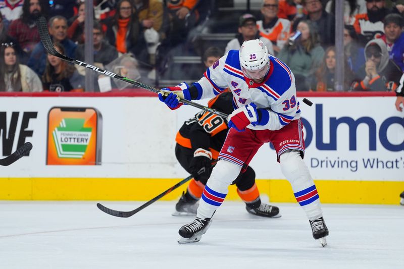 Nov 29, 2024; Philadelphia, Pennsylvania, USA; New York Rangers center Sam Carrick (39) is hit with the puck against the Philadelphia Flyers in the first period at Wells Fargo Center. Mandatory Credit: Kyle Ross-Imagn Images