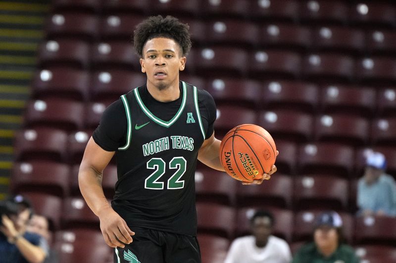 Nov 19, 2023; Charleston, SC, USA; North Texas Mean Green guard CJ Noland (22) brings the ball up court in the second half against the Towson Tigers at TD Arena. Mandatory Credit: David Yeazell-USA TODAY Sports