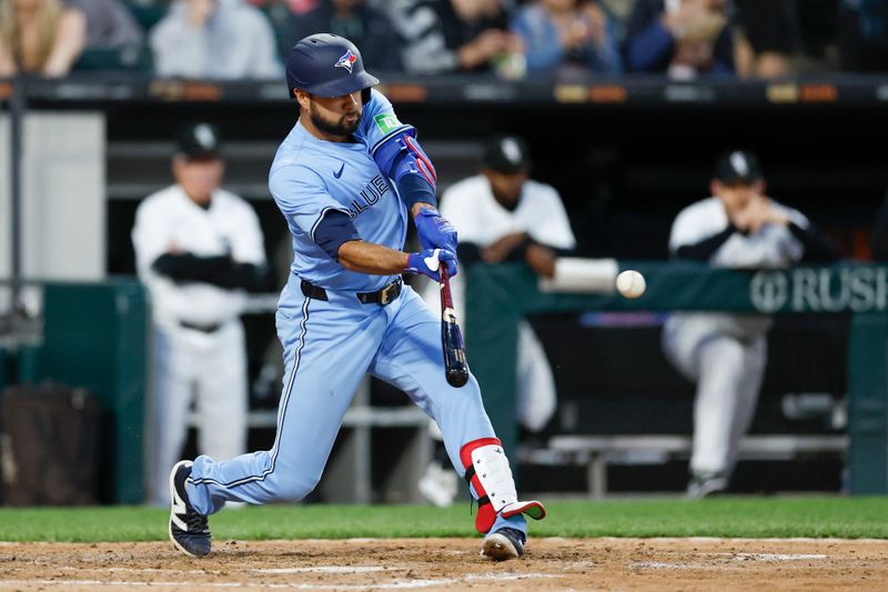 May 27, 2024; Chicago, Illinois, USA; Toronto Blue Jays third baseman Isiah Kiner-Falefa (7) grounds into a fielders choice against the Chicago White Sox during the sixth inning at Guaranteed Rate Field. Mandatory Credit: Kamil Krzaczynski-USA TODAY Sports