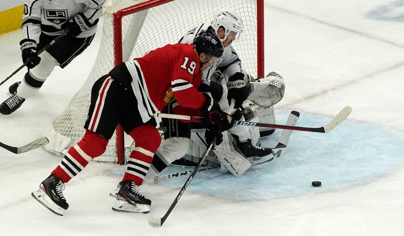 Jan 22, 2023; Chicago, Illinois, USA; Los Angeles Kings defenseman Matt Roy (3) defends Chicago Blackhawks center Jonathan Toews (19) during the first period at United Center. Mandatory Credit: David Banks-USA TODAY Sports