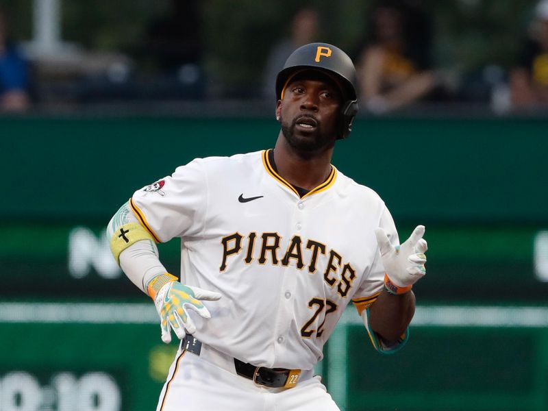 Jul 22, 2024; Pittsburgh, Pennsylvania, USA;  Pittsburgh Pirates designated hitter Andrew McCutchen (22) celebrates at second base after hitting a double against the St. Louis Cardinals during the third inning at PNC Park. Mandatory Credit: Charles LeClaire-USA TODAY Sports