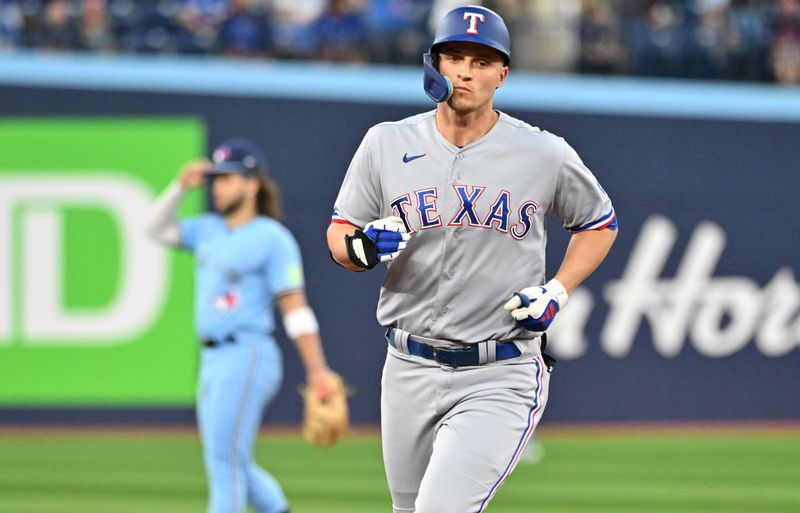 Sep 14, 2023; Toronto, Ontario, CAN;   Texas Rangers shortstop Corey Seager (5) rounds the bases after hitting a solo home run against the Toronto Blue Jays in the first inning at Rogers Centre. Mandatory Credit: Dan Hamilton-USA TODAY Sports