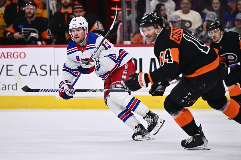 Nov 24, 2023; Philadelphia, Pennsylvania, USA; New York Rangers left wing Alexis Lafreniere (13) skates against Philadelphia Flyers center Sean Couturier (14) in the second period at Wells Fargo Center. Mandatory Credit: Kyle Ross-USA TODAY Sports