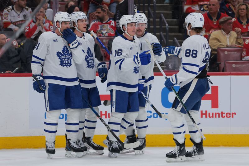 Nov 27, 2024; Sunrise, Florida, USA; Toronto Maple Leafs right wing Mitch Marner (16) celebrates with teammates after scoring against the Florida Panthers during the second period at Amerant Bank Arena. Mandatory Credit: Sam Navarro-Imagn Images