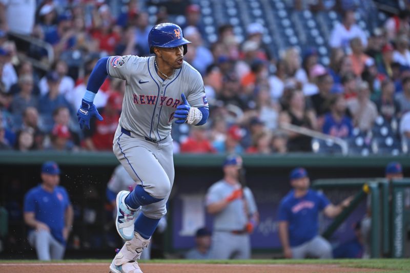 Jul 1, 2024; Washington, District of Columbia, USA; New York Mets shortstop Francisco Lindor (12) runs to first base after hitting a single against the Washington Nationals during the first inning at Nationals Park. Mandatory Credit: Rafael Suanes-USA TODAY Sports