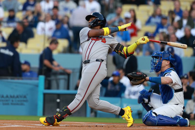 May 3, 2024; Los Angeles, California, USA;  Atlanta Braves outfielder Ronald Acuna Jr. (13) hits a single in the first inning against the Los Angeles Dodgers at Dodger Stadium. Mandatory Credit: Kiyoshi Mio-USA TODAY Sports