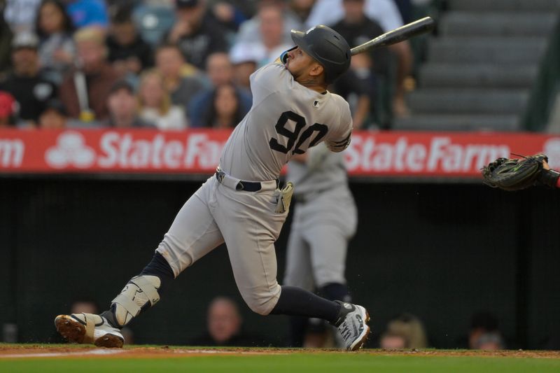 May 26, 2025; Anaheim, California, USA;  New York Yankees second baseman Jorbit Vivas (90) flies out to Los Angeles Angels center fielder Chris Taylor (33) in the third inning at Angel Stadium. Mandatory Credit: Jayne Kamin-Oncea-Imagn Images
