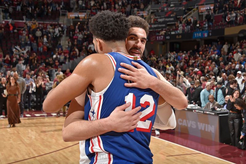 CLEVELAND, OH - MARCH 29: Georges Niang #20 of the Cleveland Cavaliers and Tobias Harris #12 of the Philadelphia 76ers embrace after the game on March 29, 2024 at Rocket Mortgage FieldHouse in Cleveland, Ohio. NOTE TO USER: User expressly acknowledges and agrees that, by downloading and/or using this Photograph, user is consenting to the terms and conditions of the Getty Images License Agreement. Mandatory Copyright Notice: Copyright 2024 NBAE (Photo by David Liam Kyle/NBAE via Getty Images)