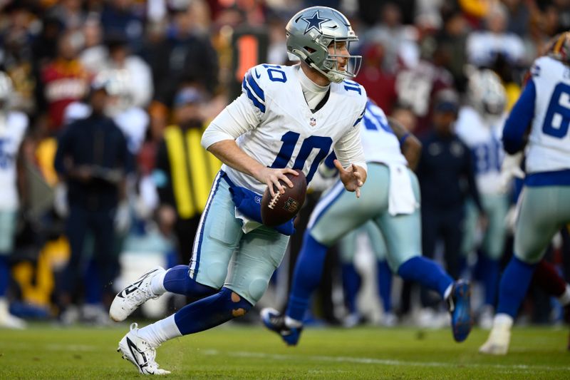 Dallas Cowboys quarterback Cooper Rush (10) looks to pass during the second half of an NFL football game against the Washington Commanders, Sunday, Nov. 24, 2024, in Landover, Md. (AP Photo/Nick Wass)