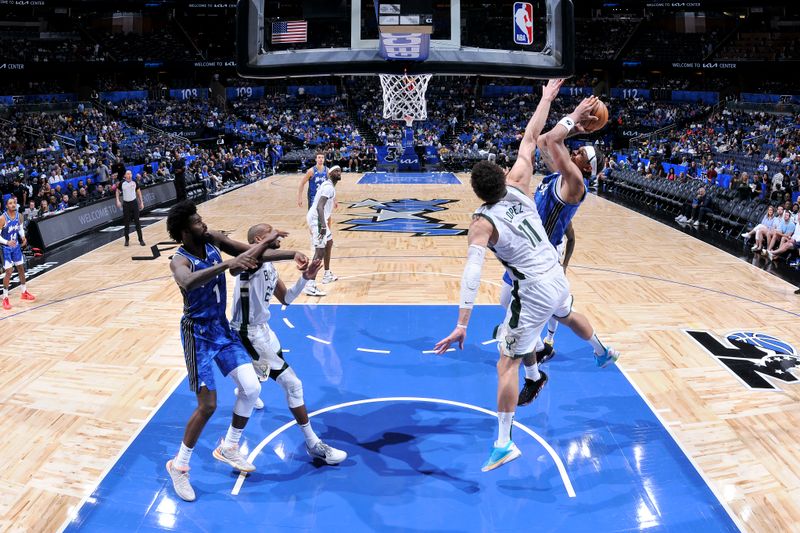 ORLANDO, FL - APRIL 14: Paolo Banchero #5 of the Orlando Magic drives to the basket during the game again the Milwaukee Bucks on April 14, 2024 at Kia Center in Orlando, Florida. NOTE TO USER: User expressly acknowledges and agrees that, by downloading and or using this photograph, User is consenting to the terms and conditions of the Getty Images License Agreement. Mandatory Copyright Notice: Copyright 2024 NBAE (Photo by Fernando Medina/NBAE via Getty Images)