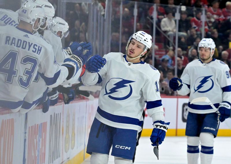 Nov 7, 2023; Montreal, Quebec, CAN; Tampa Bay Lightning forward Alex Barre-Boulet (12) celebrates with teammates after scoring a goal against the Montreal Canadiens during the first period at the Bell Centre. Mandatory Credit: Eric Bolte-USA TODAY Sports