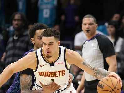 CHARLOTTE, NC - DECEMBER 23: Michael Porter Jr. #1 of the Denver Nuggets handles the ball during the game against the Charlotte Hornets on December 23, 2023 at Spectrum Center in Charlotte, North Carolina. NOTE TO USER: User expressly acknowledges and agrees that, by downloading and or using this photograph, User is consenting to the terms and conditions of the Getty Images License Agreement.  Mandatory Copyright Notice:  Copyright 2023 NBAE (Photo by Brock Williams-Smith/NBAE via Getty Images)