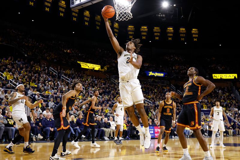 USC Trojans' Efforts Fall Short Against Michigan Wolverines in Crisler Center Clash