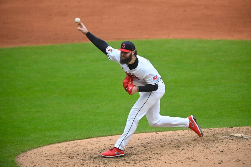 Oct 12, 2024; Cleveland, Ohio, USA; Cleveland Guardians relief pitcher Hunter Gaddis (33) pitches in the sixth inning against the Detroit Tigers during game five of the ALDS for the 2024 MLB Playoffs at Progressive Field. Mandatory Credit: David Richard-Imagn Images