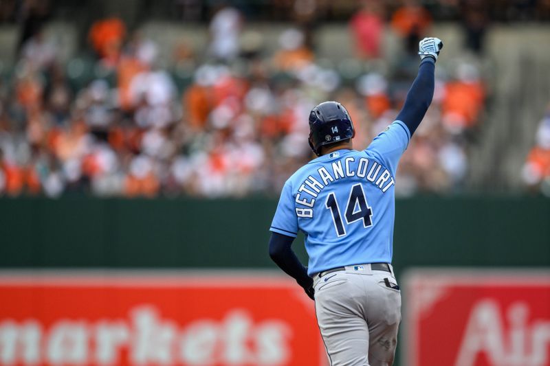 Sep 17, 2023; Baltimore, Maryland, USA; Tampa Bay Rays catcher Christian Bethancourt (14) hits a home run during the eighth inning against the Baltimore Orioles at Oriole Park at Camden Yards. Mandatory Credit: Reggie Hildred-USA TODAY Sports