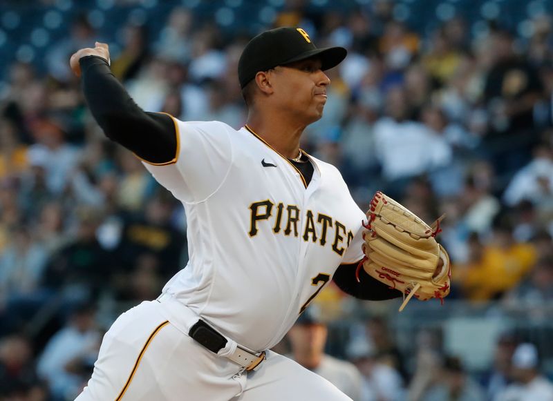 Sep 15, 2023; Pittsburgh, Pennsylvania, USA;  Pittsburgh Pirates starting pitcher Johan Oviedo (24) delivers a pitch against the New York Yankees during the first inning at PNC Park. Mandatory Credit: Charles LeClaire-USA TODAY Sports