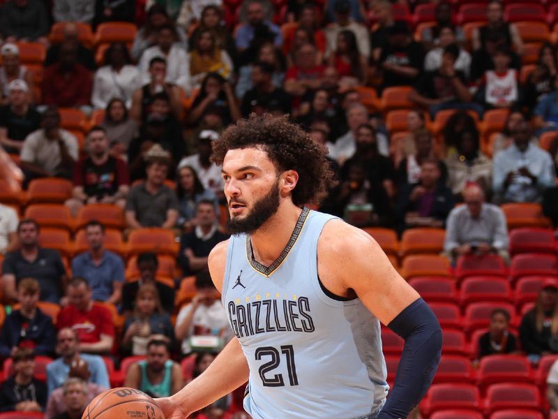 MIAMI, FL - JANUARY 24:  David Roddy #21 of the Memphis Grizzlies handles the ball during the game against the Miami Heat on January 24, 2024 at Kaseya Center in Miami, Florida. NOTE TO USER: User expressly acknowledges and agrees that, by downloading and or using this Photograph, user is consenting to the terms and conditions of the Getty Images License Agreement. Mandatory Copyright Notice: Copyright 2024 NBAE (Photo by Issac Baldizon/NBAE via Getty Images)