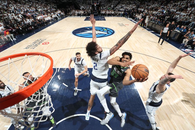 MINNEAPOLIS, MN - MAY 30: Karl-Anthony Towns #32 of the Minnesota Timberwolves drives to the basket during the game against the Dallas Mavericks during Round 3 Game 5 of the 2024 NBA Playoffs on May 30, 2024 at Target Center in Minneapolis, Minnesota. NOTE TO USER: User expressly acknowledges and agrees that, by downloading and or using this Photograph, user is consenting to the terms and conditions of the Getty Images License Agreement. Mandatory Copyright Notice: Copyright 2024 NBAE (Photo by Joe Murphy/NBAE via Getty Images)