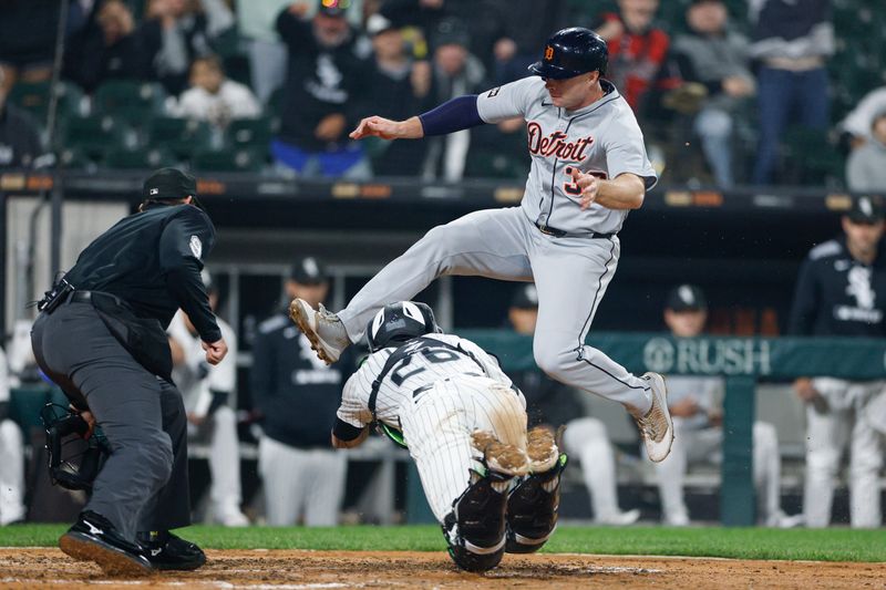 Jun 4, 2025; Chicago, Illinois, USA; Chicago White Sox catcher Korey Lee (26) tags out at home plate Detroit Tigers designated hitter Colt Keith (33) during the eight inning at Rate Field. Mandatory Credit: Kamil Krzaczynski-Imagn Images