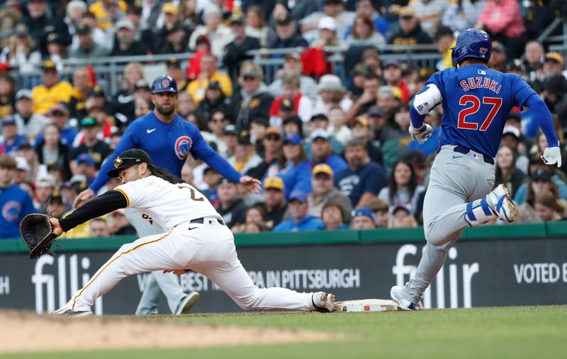 May 11, 2024; Pittsburgh, Pennsylvania, USA;  Chicago Cubs right fielder Seiya Suzuki (27) beats the throw to Pittsburgh Pirates first baseman Connor Joe (2) for an infield single during the fifth inning at PNC Park. Mandatory Credit: Charles LeClaire-USA TODAY Sports