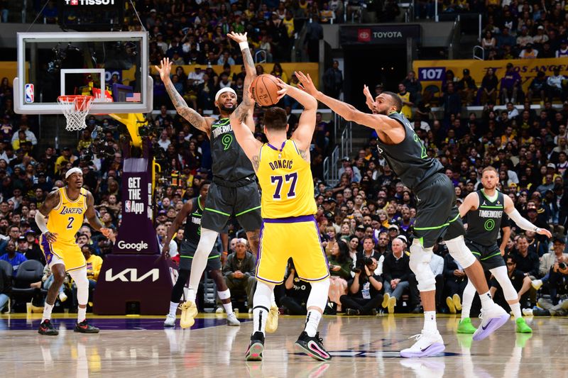 LOS ANGELES, CA - APRIL 30: Luka Doncic #77 of the Los Angeles Lakers looks to pass the ball during the game against the Minnesota Timberwolves during Round One Game Five of the 2025 NBA Playoffs on April 30, 2025 at Crypto.Com Arena in Los Angeles, California. NOTE TO USER: User expressly acknowledges and agrees that, by downloading and/or using this Photograph, user is consenting to the terms and conditions of the Getty Images License Agreement. Mandatory Copyright Notice: Copyright 2025 NBAE (Photo by Adam Pantozzi/NBAE via Getty Images)