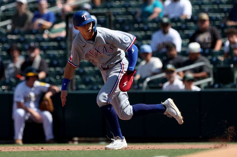 Aug 31, 2025; West Sacramento, California, USA; Texas Rangers center fielder Michael Helman (24) steals second base against the Athletics during the fifth inning at Sutter Health Park. Mandatory Credit: Dennis Lee-Imagn Images
