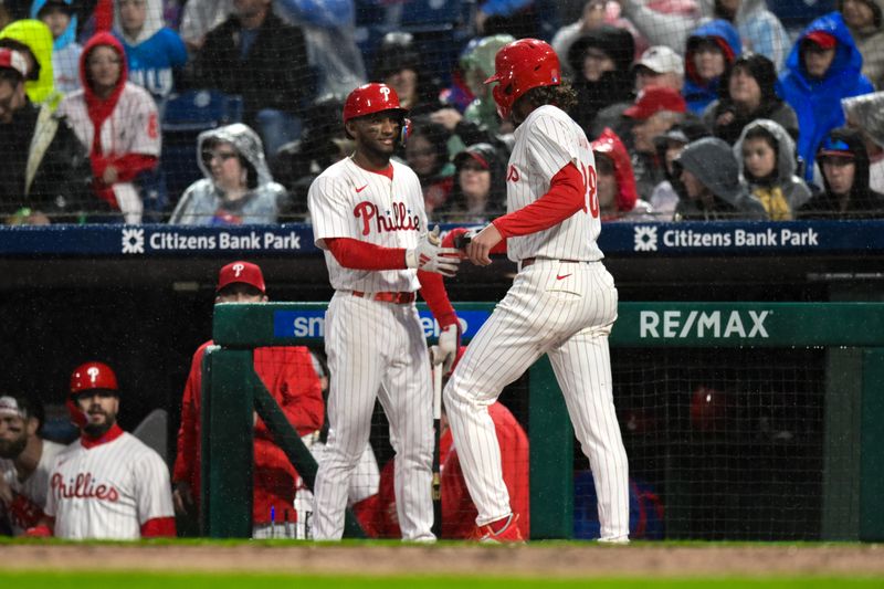 May 4, 2024; Philadelphia, Pennsylvania, USA; Philadelphia Phillies third baseman Alec Bohm (28) is greeted by Philadelphia Phillies outfielder Johan Rojas (18) after scoring on a RBI single by Philadelphia Phillies second baseman Bryson Stott (not pictured) during the first inning against the San Francisco Giants at Citizens Bank Park. Mandatory Credit: John Jones-USA TODAY Sports