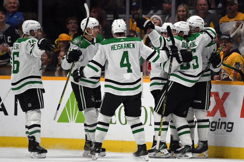 Dec 23, 2023; Nashville, Tennessee, USA; Dallas Stars players celebrate after center Craig Smith (15) scored to tie the game late in the third period against the Nashville Predators at Bridgestone Arena. Mandatory Credit: Christopher Hanewinckel-USA TODAY Sports