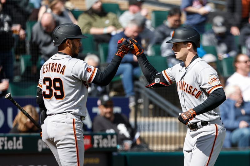 Apr 6, 2023; Chicago, Illinois, USA; San Francisco Giants center fielder Mike Yastrzemski (5) celebrates with second baseman Thairo Estrada (39) after hitting a two-run home run against the Chicago White Sox during the fifth inning at Guaranteed Rate Field. Mandatory Credit: Kamil Krzaczynski-USA TODAY Sports