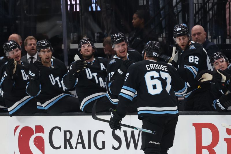 Feb 25, 2025; Salt Lake City, Utah, USA; Utah Hockey Club left wing Lawson Crouse (67) celebrates a goal against the Chicago Blackhawks with teammates during the third period at Delta Center. Mandatory Credit: Rob Gray-Imagn Images