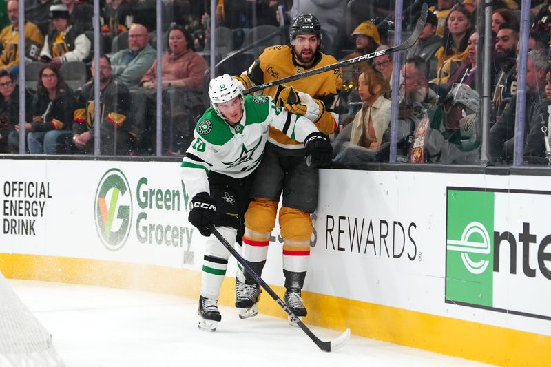 Dec 6, 2024; Las Vegas, Nevada, USA; Dallas Stars center Oskar Bäck (10) checks Vegas Golden Knights defenseman Nicolas Hague (14) during the first period at T-Mobile Arena. Mandatory Credit: Stephen R. Sylvanie-Imagn Images