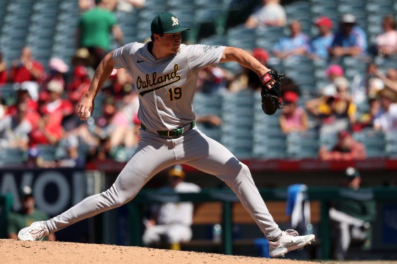 Jun 26, 2024; Anaheim, California, USA;  Oakland Athletics relief pitcher Mason Miller (19) pitches during the eighth inning against the Los Angeles Angels at Angel Stadium. Mandatory Credit: Kiyoshi Mio-USA TODAY Sports