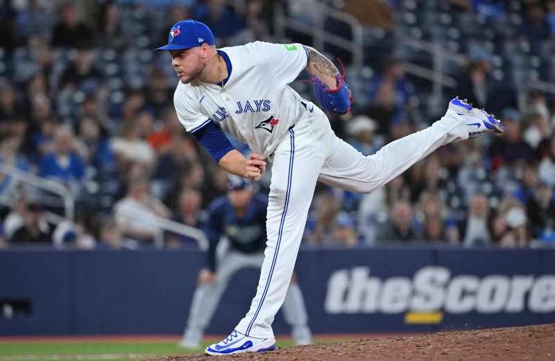 May 14, 2025; Toronto, Ontario, CAN;  Toronto Blue Jays relief pitcher Yariel Rodriguez (29) delivers a pitch against the Tampa Bay Rays in the eighth inning at Rogers Centre. Mandatory Credit: Dan Hamilton-Imagn Images