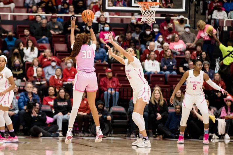 Feb 17, 2023; Stanford, California, USA;  USC Trojans forward Kadi Sissoko (30) shoots over Stanford Cardinal center Lauren Betts (51) during the first half at Maples Pavilion. Mandatory Credit: John Hefti-USA TODAY Sports